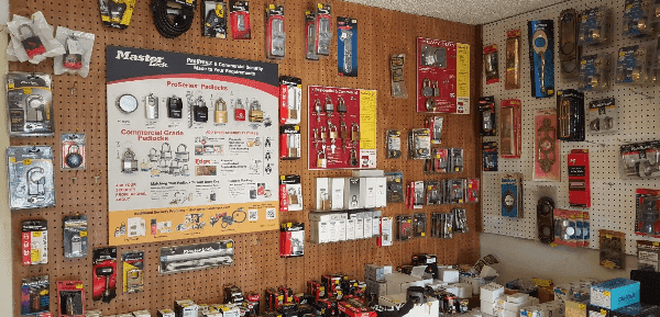 Wall display of commercial-grade padlocks and security hardware stocked inside Bills Lock and Key shop in Marble Falls, TX